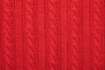 Red cable knitting fabric background