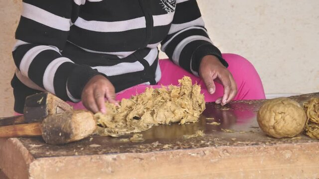 Woman Pounding Paper Fibers To Make Recycled Paper, Madagascar p2