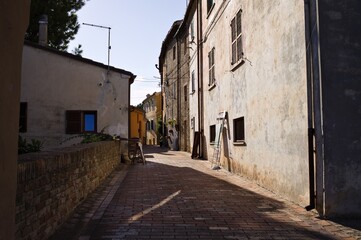 Fototapeta na wymiar An alley in a medieval italian village (Corinaldo, Marche, Italy)