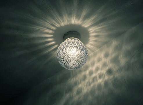 Old vintage luster glass globe with a light bulb.