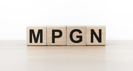 MPGN the word on wooden cubes, cubes are standing on a light background. Medicine concept
