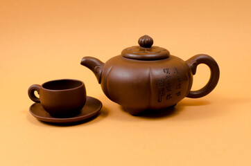 Cup and teapot on the table