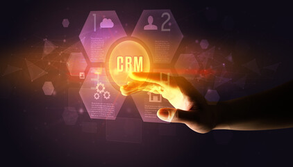Hand touching CRM inscription, new technology concept