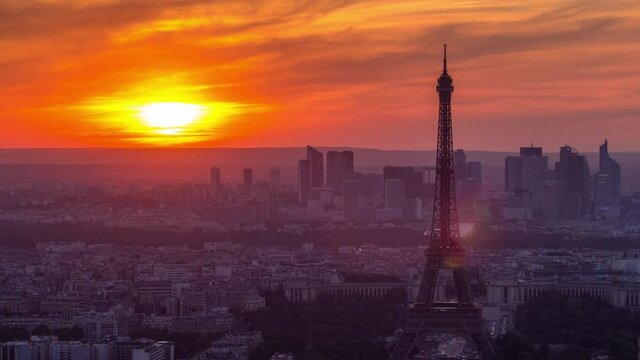 Panorama of Paris at sunset timelapse. Eiffel tower view from observation deck of montparnasse building in Paris - France. Colorful sky at summer day