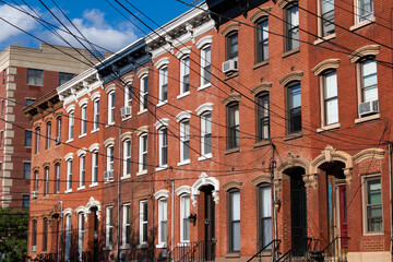 Fototapeta premium Row of Beautiful Old Brick Neighborhood Homes in Hamilton Park of Jersey City