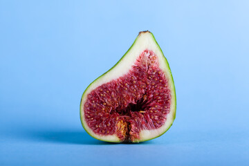 Fresh fig fruit on blue background.