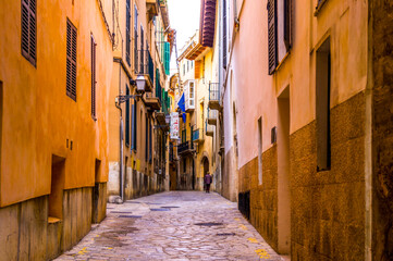 Fototapeta na wymiar Narrow street alley of Mallorca, Spain