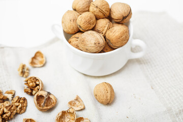 walnuts on a white wooden background