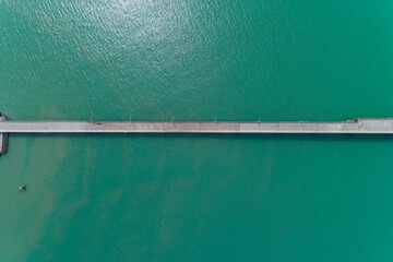 Aerial top view drone shot of small bridge in the sea image transportation background concept and travel design.
