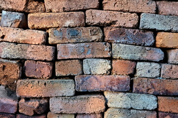 Brick wall without cement. Old burnt brick. Brick background. Construction Materials.