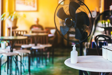 Alcohol gel bottle for hands cleaning to prevent the spreading of the Corona virus (Covid-19), Place the entrance service for customers  in the cafe. Healthcare concept. New normal lifestyle.