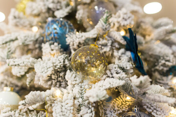 Christmas-tree decorations on a christmas fir-tree. Holidays and decor concept.