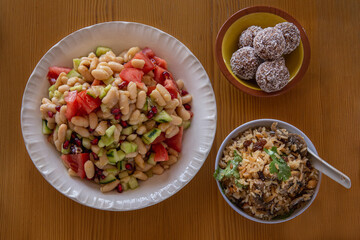 healthy food dishes with white beans, lentils, sweet potatoes, rice and vegetables