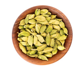Cardamom seeds in wooden bowl, isolated on white background. Pile of green cardamom. Top view.