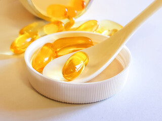 Fish oil capsules with omega 3 and vitamin D, heart care, cholesterol control diet.