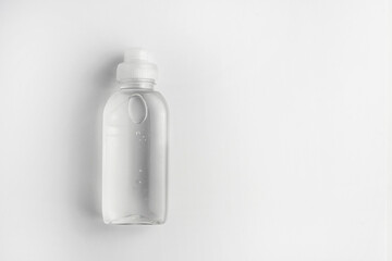 Bottle with antiseptic gel with blue background
