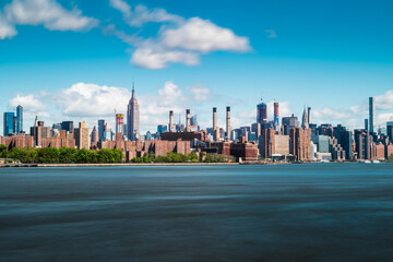Manhattan New York City Skyline on a beautiful sunny and cloudy blue sky day