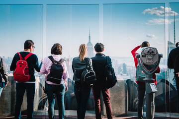 People and tourists enjoying the Manhattan skyline and Empire State Building of New York City