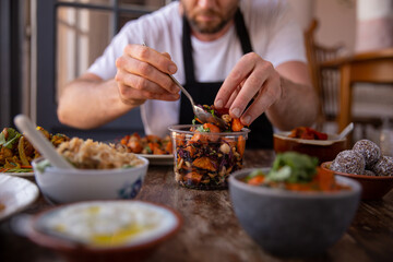 Chef preparing healthy food to take away at home