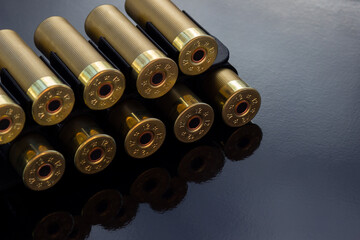 Gold cartridges on the black glossy background