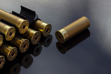 Gold cartridges on the black glossy background