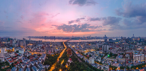 Obraz premium The yellow crane tower.Aerial view of Wuhan city .Panoramic skyline and buildings beside yangtze river.