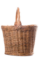 Empty Wicker Basket Isolated on White Background. Traditional craftsman made rounded brown wicker basket. Studio shot