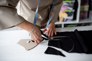 Process making masks against covid -19. Close-up of female hands Pattern of masks.