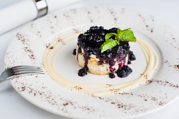 Blueberry pie on a white plate