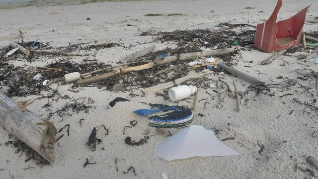Random Plastic Trash Washed Up On Beach, Environmental Pollution