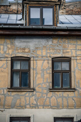 Fototapeta na wymiar Pair of windows on an old building