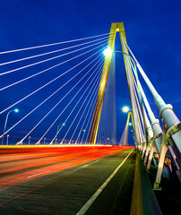 Headlights, Taillights, streaming at dusk across Arthur Ravenel Bridge.
