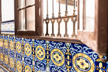 Traditional blue tiles decorate the interior of an interior corridor of an old house.