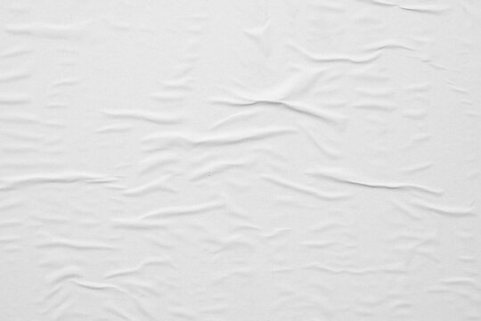 Blank white crumpled and creased paper poster texture background © Piman Khrutmuang