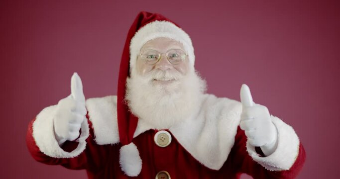 Santa Claus showing thumb-up. Santa Claus with real beard and great smiling giving thumb up. 4K.