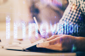 Writing man's hands background with technology icons.