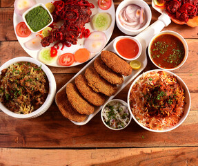 Assorted indian foods Chicken biryani,mutton biryani,tandoori chicken and chicken russian kebab on...