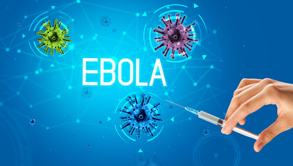 Obraz na płótnie Canvas Syringe, medical injection in hand with EBOLA inscription, coronavirus vaccine concept