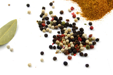 Wide variety spices and herbs on background of white table, with empty space for text or label.