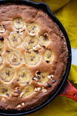 Closeup of pan cookie with hazelnuts and banana slices