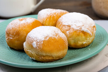 .Plate of Krapfen with cream