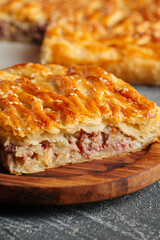Closeup on cut pie with beef and potatoes filling