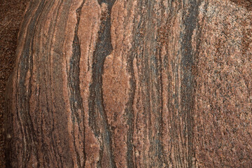 Granite surface treated with atmosphere and time, shot close-up