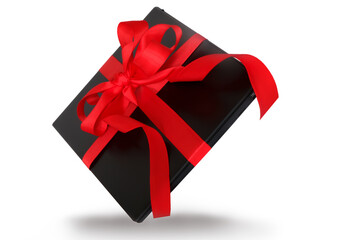 New modern laptop, decorated with red ribbon, isolated on a white background. The concept of shopping in online stores, gift ideas. black Friday.