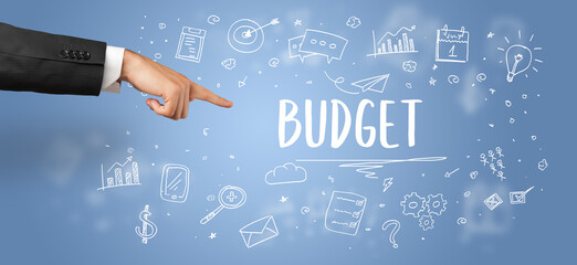 Close-Up of cropped hand pointing at BUDGET inscription, modern business solution concept