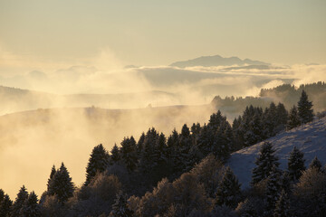 Winter sunset over the mountains with clouds