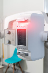 Hospital X-ray machine. Equipment for roentgen in modern clinic. Selective focus on monitor.