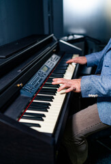 Playing classic piano. Professional musician pianist hands on piano keys. Selective focus.