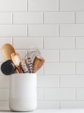 Kitchen Background With Kitchen Utensils In Ceramic Jar