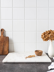 White kitchen background with brown kitchen utensils